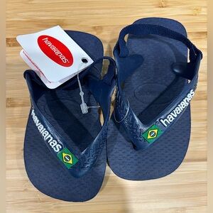 Navy blue Havaianas with original tag.